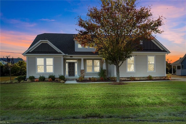 craftsman-style house with a lawn