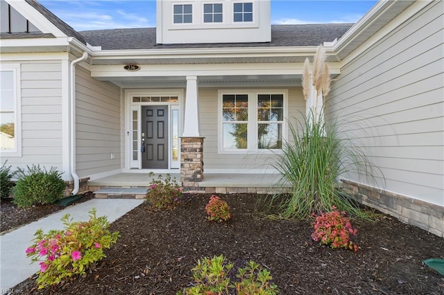 view of exterior entry featuring a porch