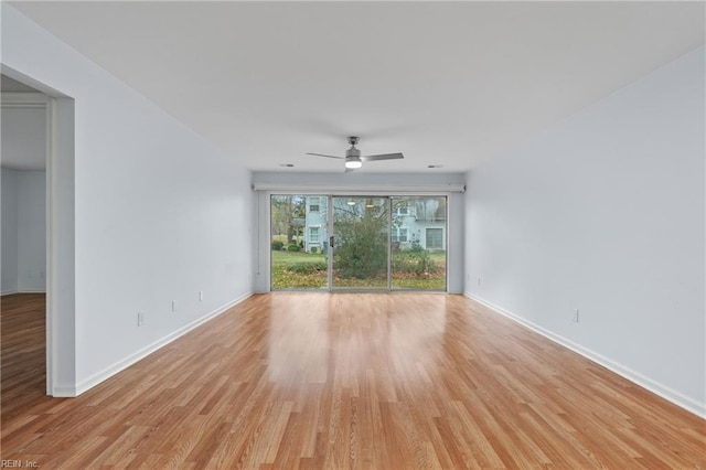 unfurnished room featuring ceiling fan and light wood-type flooring