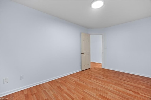 spare room with light hardwood / wood-style floors