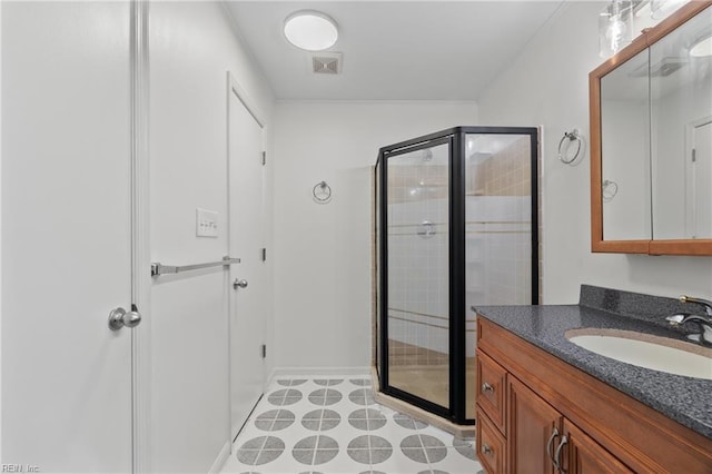 bathroom with vanity and an enclosed shower