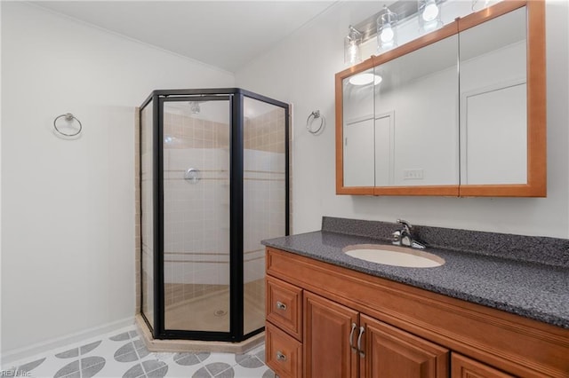 bathroom featuring tile patterned flooring, vanity, and walk in shower