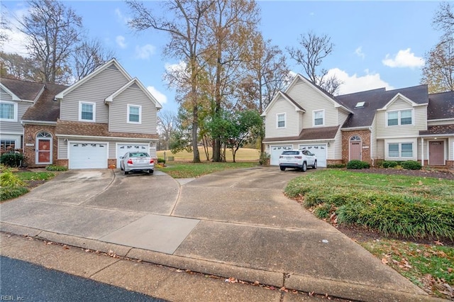 view of front of home with a front yard and a garage