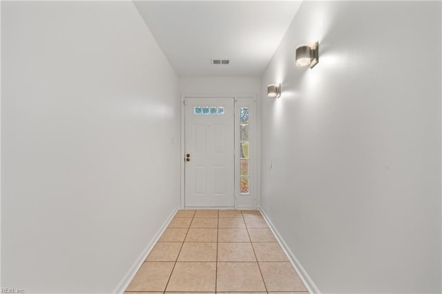 entryway featuring light tile patterned flooring