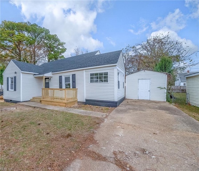 view of front of home featuring a deck and a storage unit