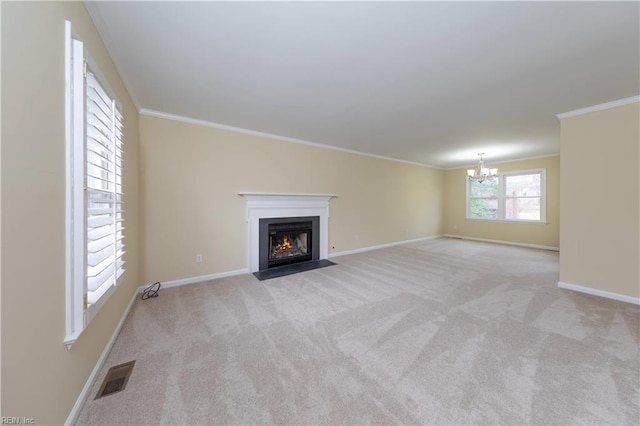 unfurnished living room with light carpet, an inviting chandelier, and ornamental molding