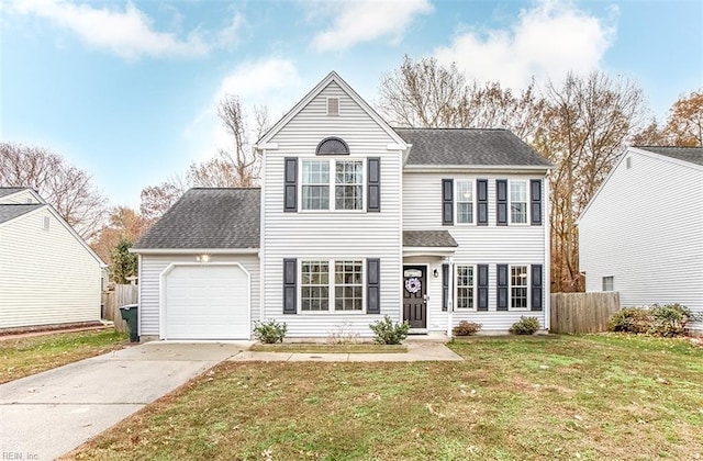 view of front of home featuring a front lawn and a garage