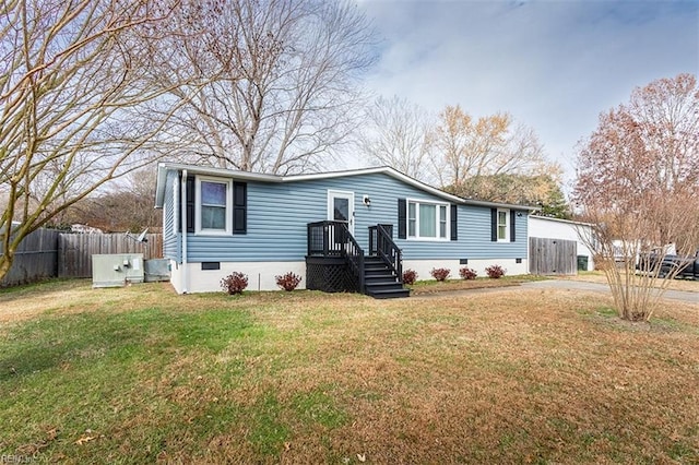 manufactured / mobile home with a front lawn