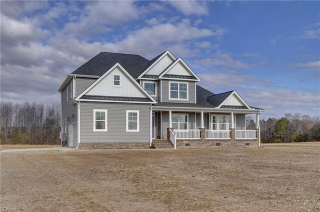 craftsman inspired home with covered porch and a garage