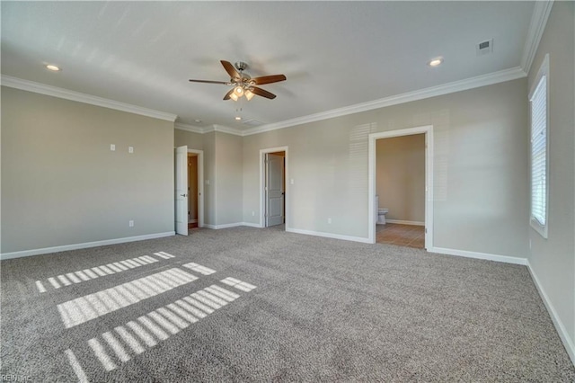 spare room featuring crown molding, ceiling fan, and light colored carpet