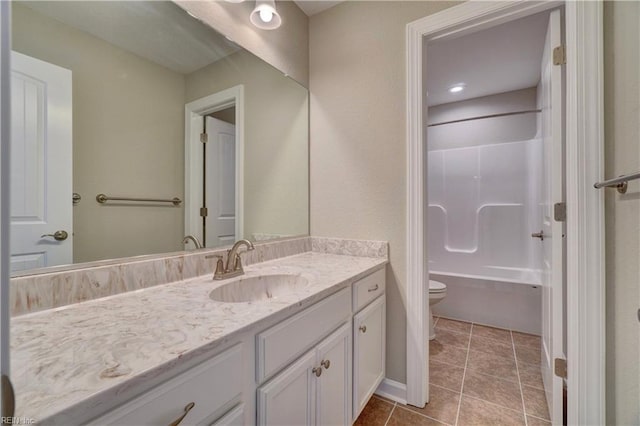 bathroom with tile patterned floors, vanity, and toilet