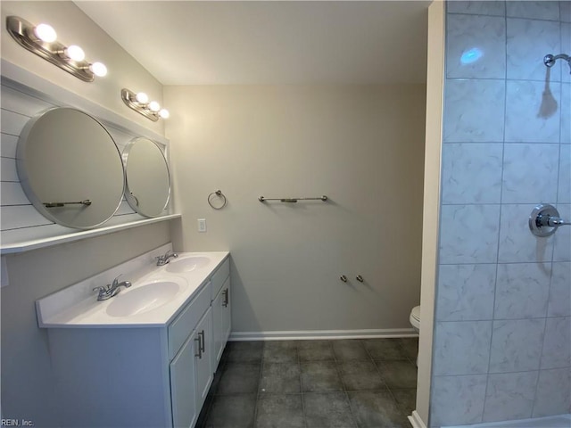 bathroom featuring toilet and vanity