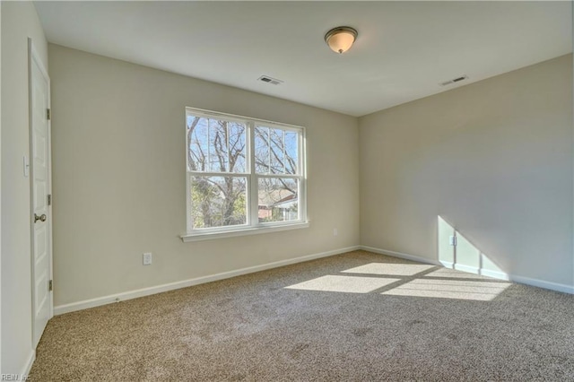 unfurnished room with carpet flooring