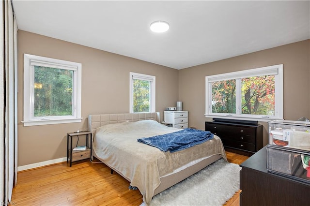 bedroom with light hardwood / wood-style flooring