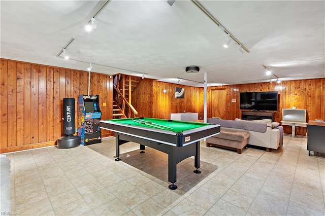 playroom featuring wooden walls, rail lighting, and pool table