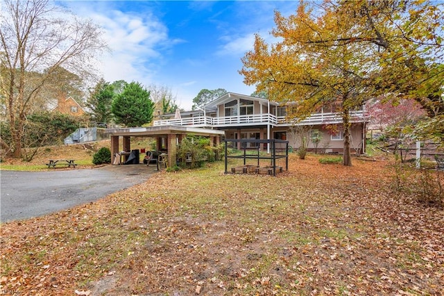 exterior space featuring a sunroom