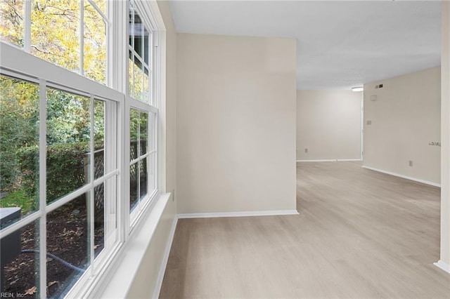 unfurnished room featuring light hardwood / wood-style floors