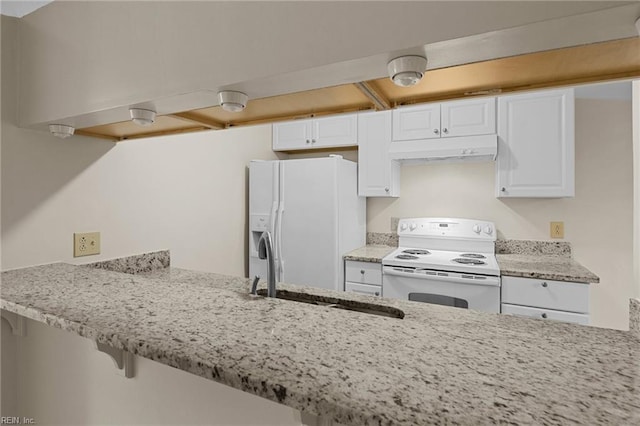 kitchen with white cabinetry, sink, light stone counters, kitchen peninsula, and white appliances