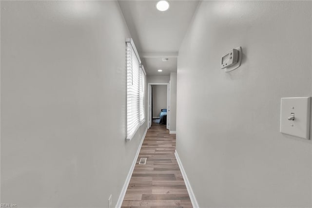 hallway with light wood-type flooring