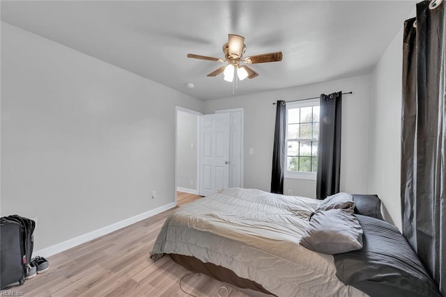 bedroom featuring light hardwood / wood-style flooring and ceiling fan