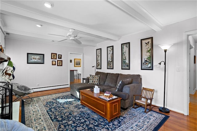 living room with beam ceiling, ceiling fan, a baseboard radiator, and wood-type flooring