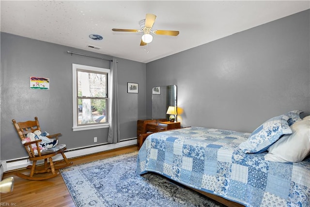 bedroom featuring hardwood / wood-style floors and ceiling fan