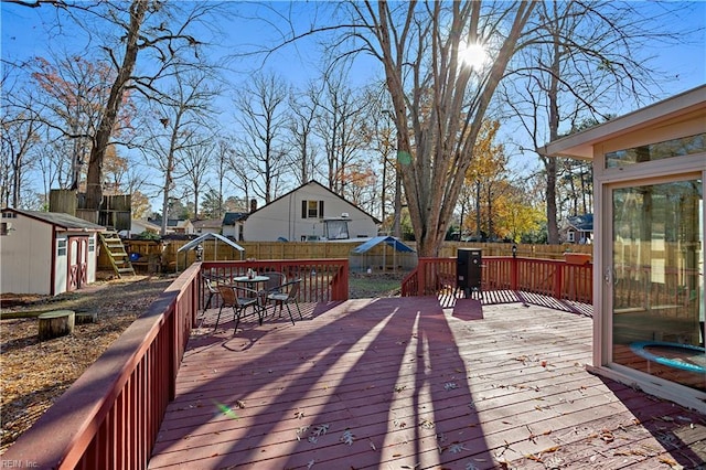 wooden deck with a storage unit