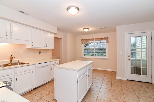 kitchen featuring white cabinets, dishwasher, plenty of natural light, and sink