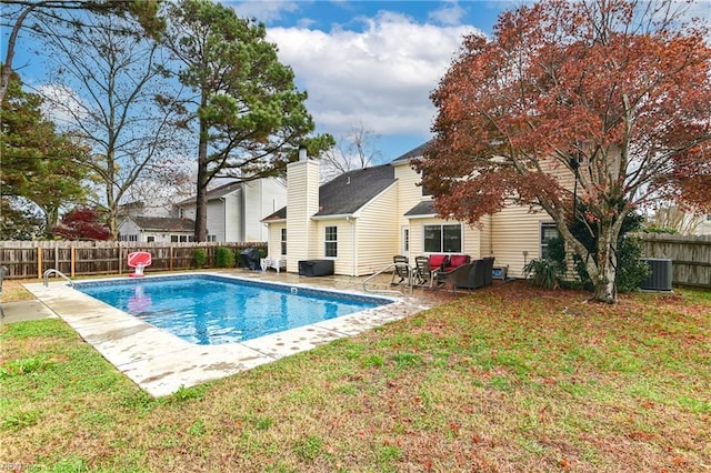 view of swimming pool with a lawn, an outdoor hangout area, central air condition unit, and a patio