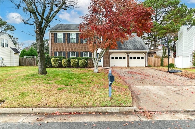 view of front facade featuring a front yard and a garage