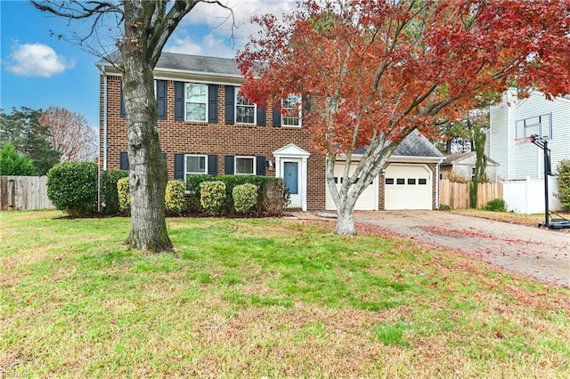 view of front of home with a front yard and a garage