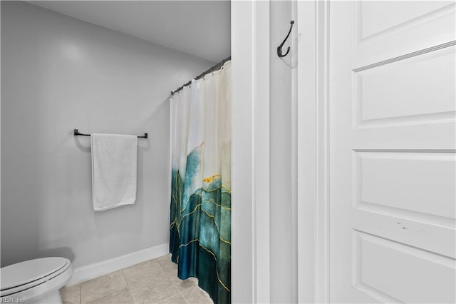 bathroom with tile patterned floors and toilet