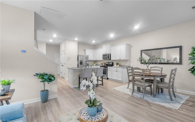 dining room featuring light wood-type flooring