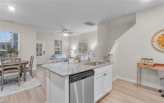 kitchen featuring ceiling fan, dishwasher, sink, light hardwood / wood-style floors, and white cabinets