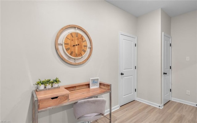 office area with light hardwood / wood-style floors