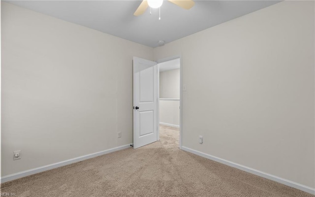 unfurnished room with light carpet and ceiling fan