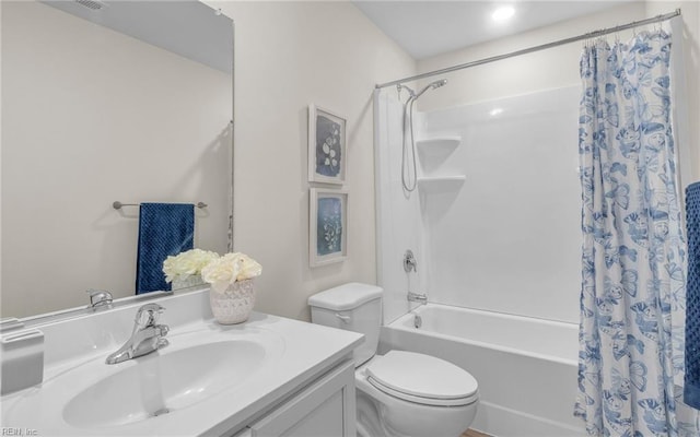 full bathroom featuring shower / tub combo, vanity, and toilet