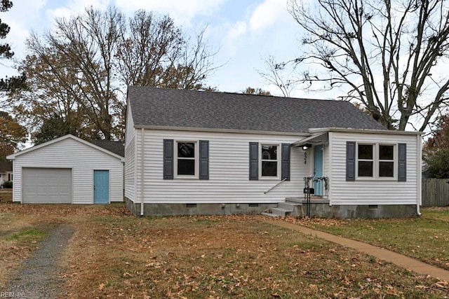 view of front of house featuring an outdoor structure and a garage