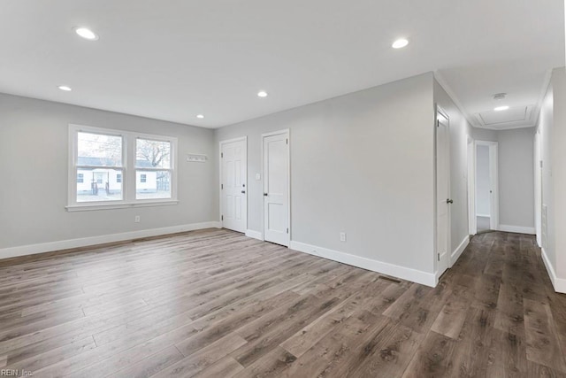 unfurnished room with hardwood / wood-style flooring