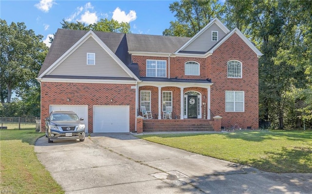 view of front of house featuring a porch, a garage, and a front lawn