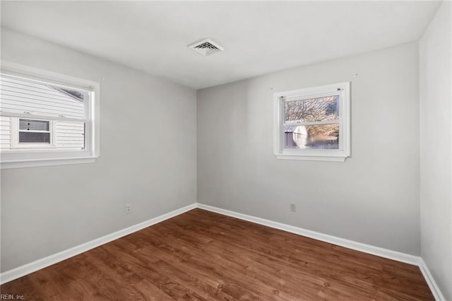 spare room featuring hardwood / wood-style flooring