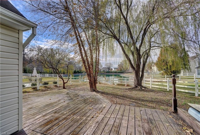 wooden terrace with a water view