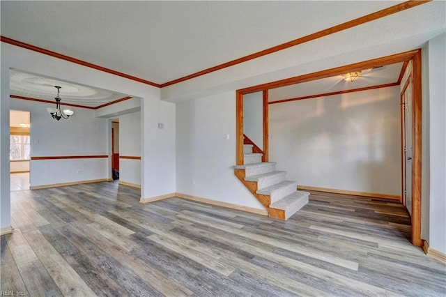 interior space featuring crown molding, a chandelier, and hardwood / wood-style flooring