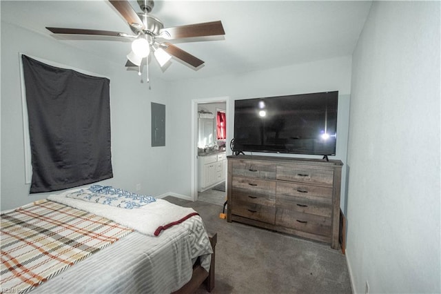 bedroom with ceiling fan, dark carpet, electric panel, and connected bathroom