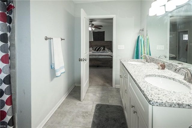 bathroom with ceiling fan, curtained shower, and vanity