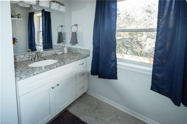 bathroom with tile patterned flooring and vanity