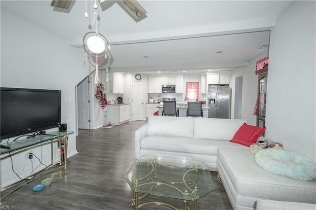 living room with dark hardwood / wood-style flooring