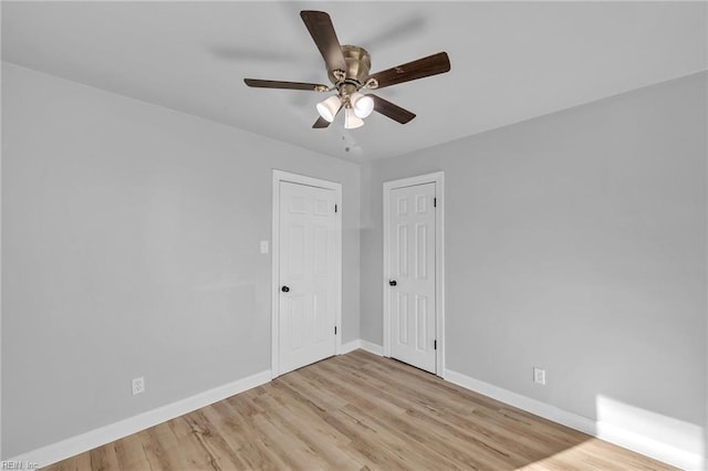 spare room with ceiling fan and light hardwood / wood-style flooring