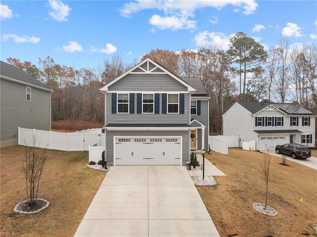 view of front of property featuring a garage and a front lawn