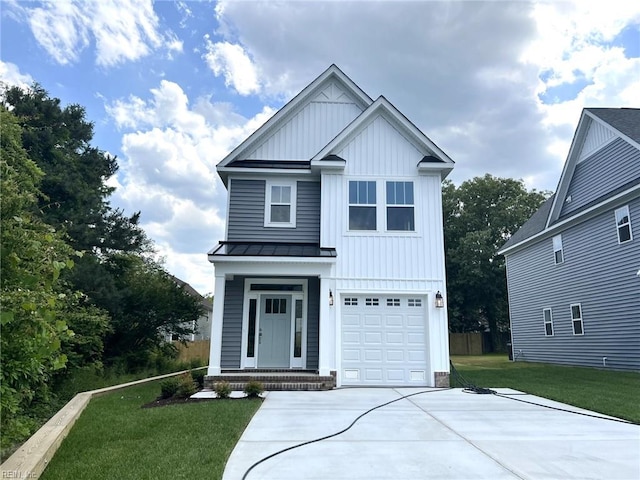 view of front of house featuring a front lawn and a garage